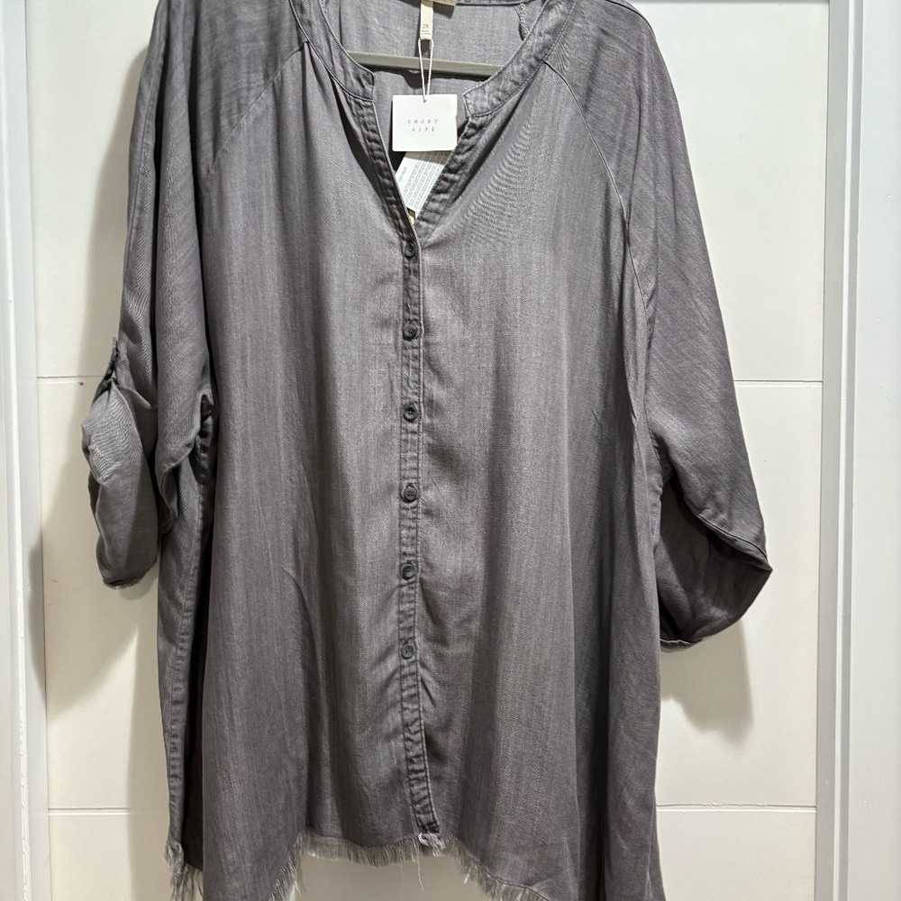 Brand new gray silver tunic top with frayred bottom.